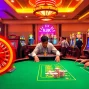 KJC AC 1 casino scene showcasing poker, roulette, and vibrant slots.