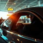 Engage with luxurious Chauffeur Services near me, featuring a professional chauffeur with a sleek sedan at an airport.