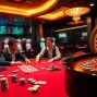 Experience the excitement of 88bet with players engaged at a luxurious poker table.