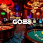 GO88 players enjoying thrilling casino games in a luxurious setting.